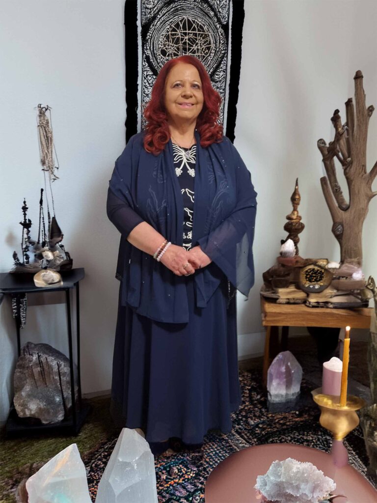 Lavinia in mystical setting with crystals.