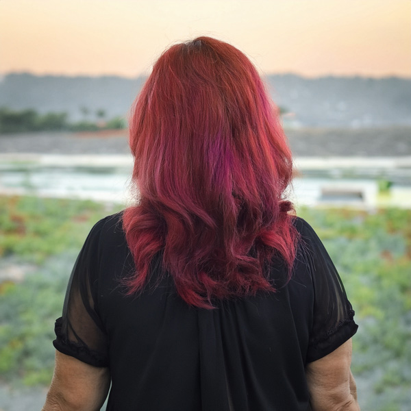 Woman with red hair facing away